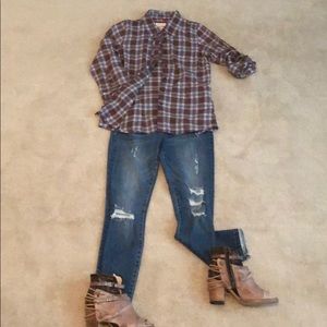 Adorable plaid shirt with ruffle detail.